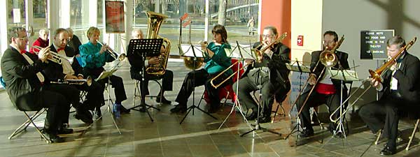 The brass entertain the crowds in the lobby